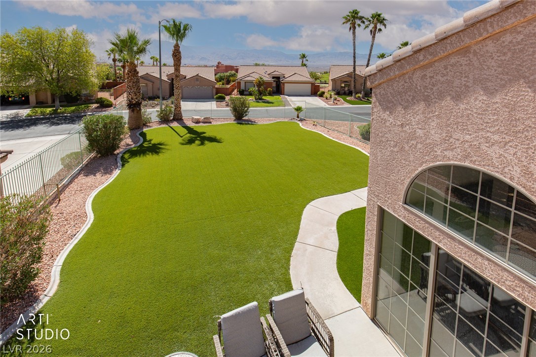 387 Silver Road Mesquite, NV 89027 - Photo 27 of 46 Manicured green lawns and clean concrete walkways define this desert yard.
