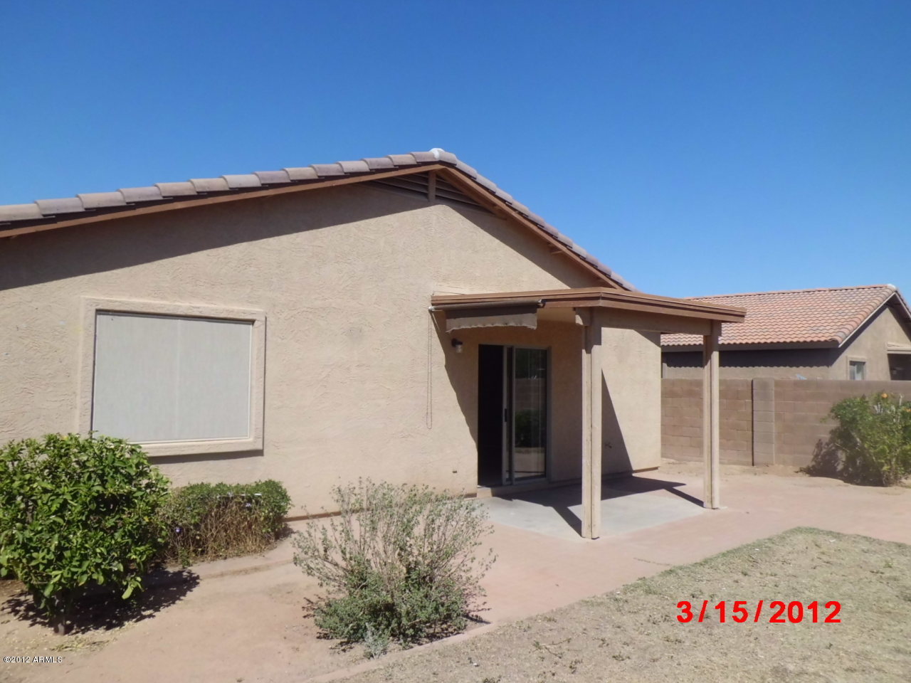 16157 West Hearn Road Surprise, AZ 85379 - Photo 14 of 15 backyard facing house