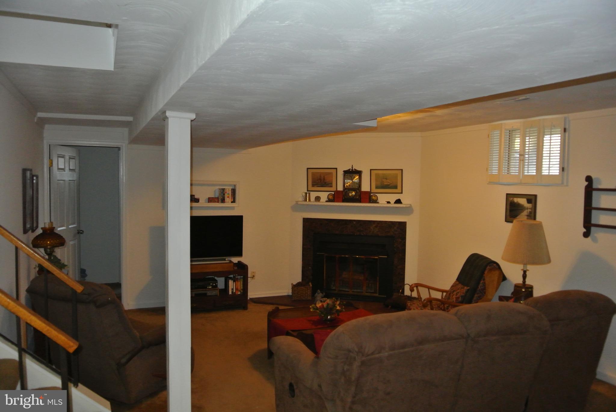 511 Gladhill Road Odenton, MD 21113 - Photo 26 of 38 Family room with wood-burning fireplace