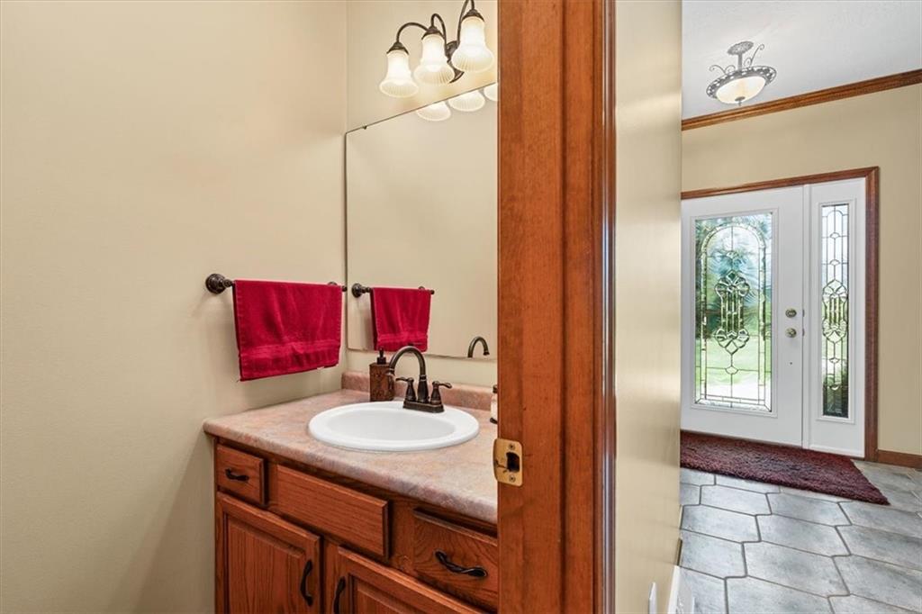 204 Salt Works Road Harmony, PA 16037 - Photo 14 of 35 a bathroom with a sink and a mirror