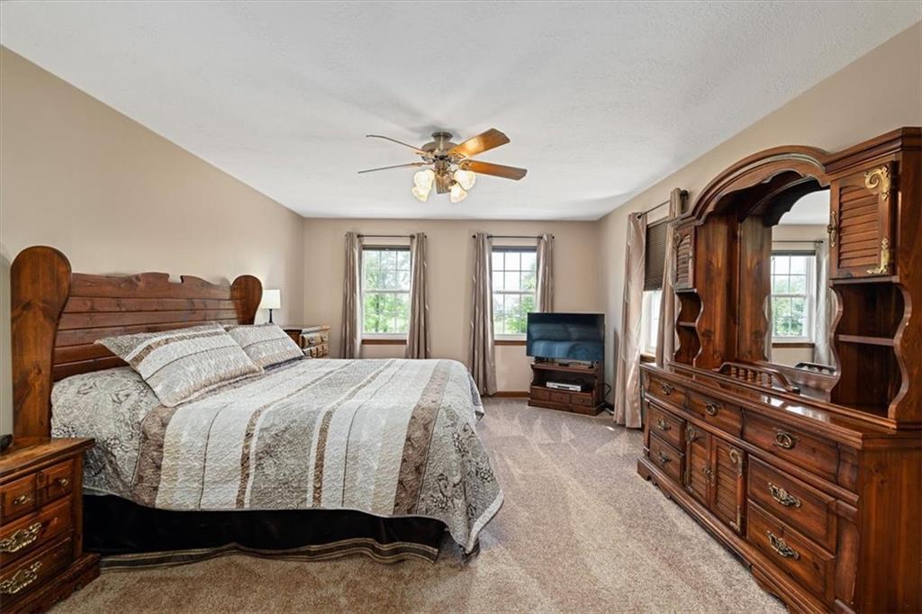 204 Salt Works Road Harmony, PA 16037 - Photo 16 of 35 a bedroom with a bed and a flat tv screen on dresser