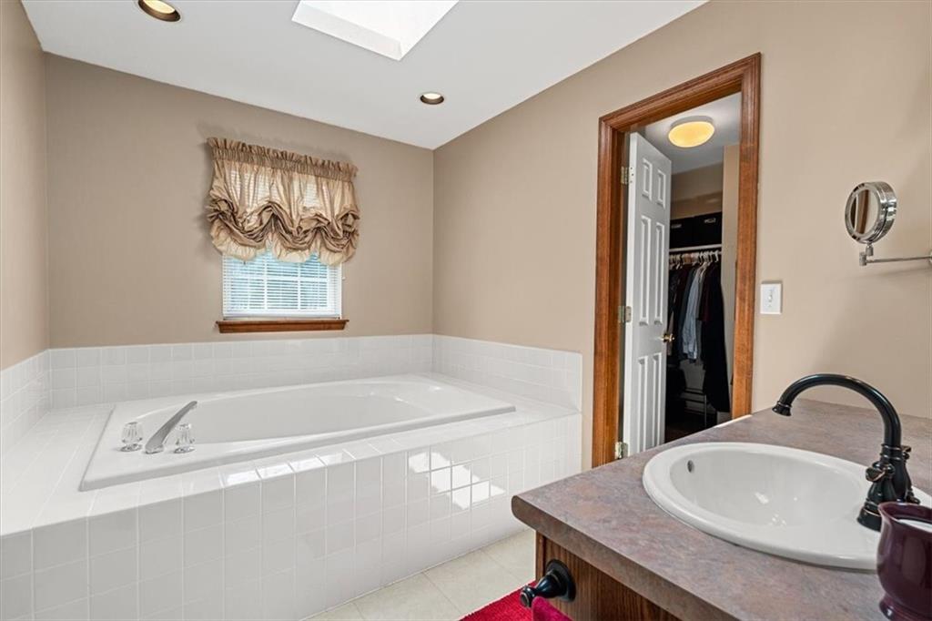 204 Salt Works Road Harmony, PA 16037 - Photo 18 of 35 a bath tub sitting next to a bathroom sink