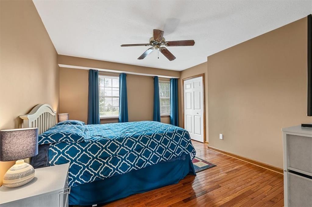 204 Salt Works Road Harmony, PA 16037 - Photo 20 of 35 a bedroom with a bed and dresser with wooden floor