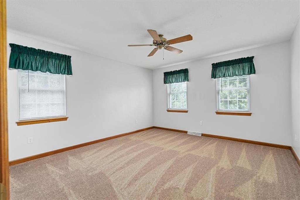 204 Salt Works Road Harmony, PA 16037 - Photo 22 of 35 a view of an empty room with a window