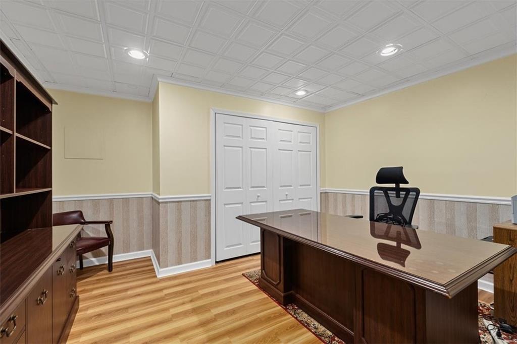 204 Salt Works Road Harmony, PA 16037 - Photo 25 of 35 a view of a workspace with furniture and wooden floor
