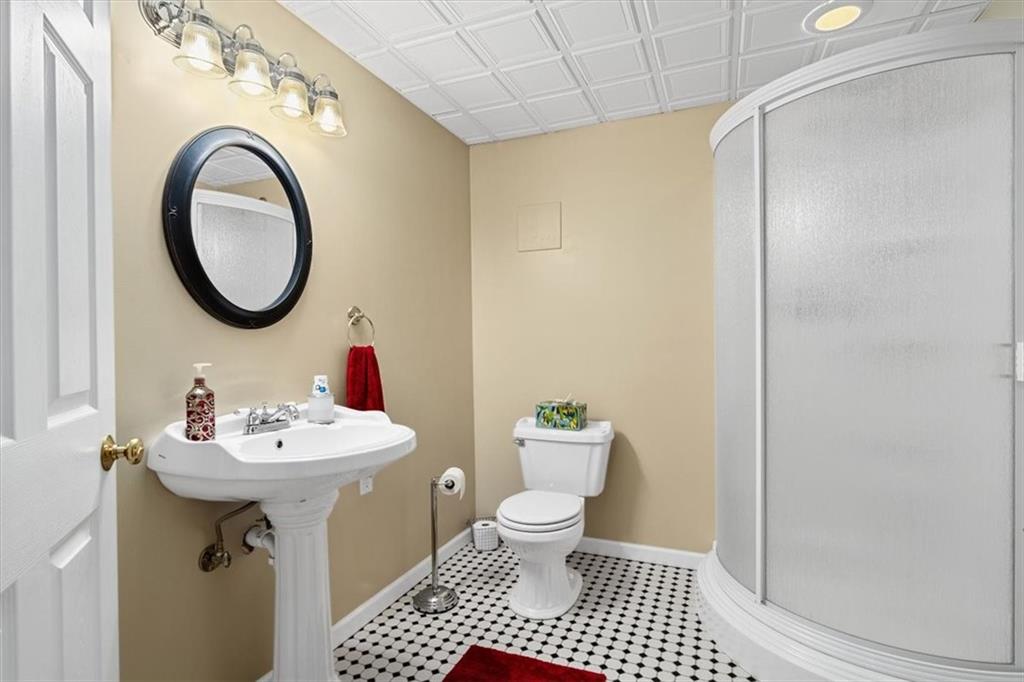204 Salt Works Road Harmony, PA 16037 - Photo 28 of 35 a bathroom with a sink a toilet and a mirror