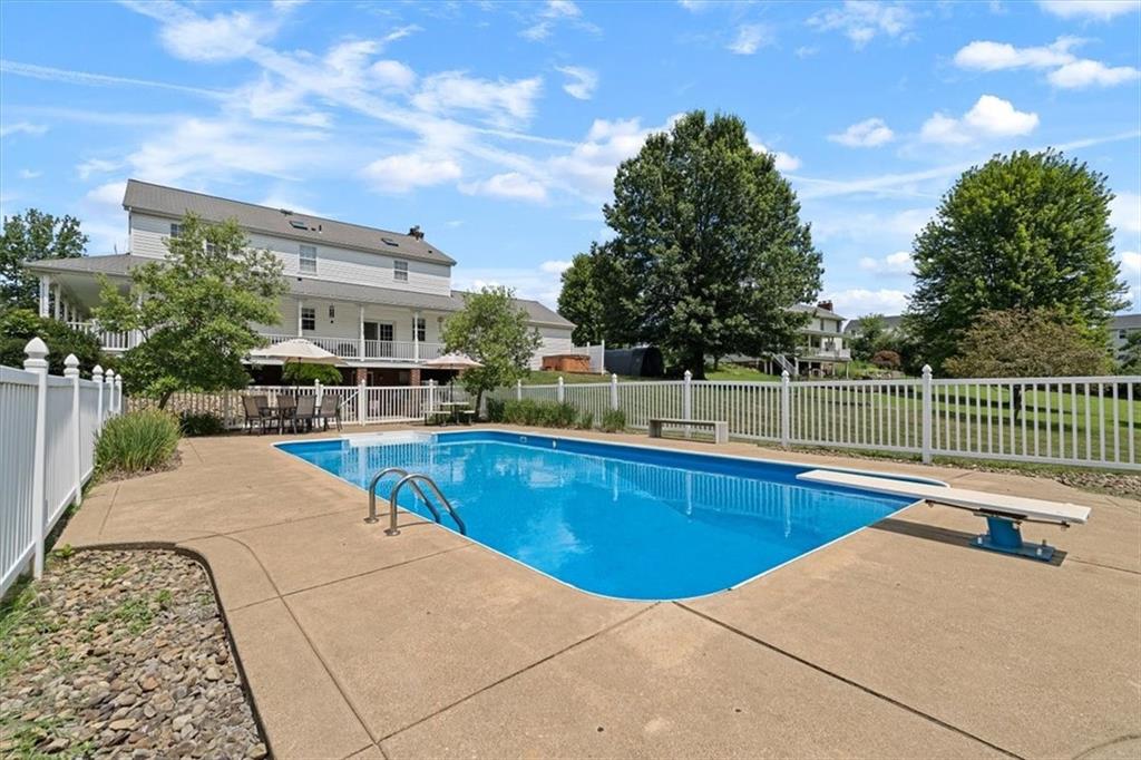 204 Salt Works Road Harmony, PA 16037 - Photo 31 of 35 a view of a swimming pool with a lounge chair