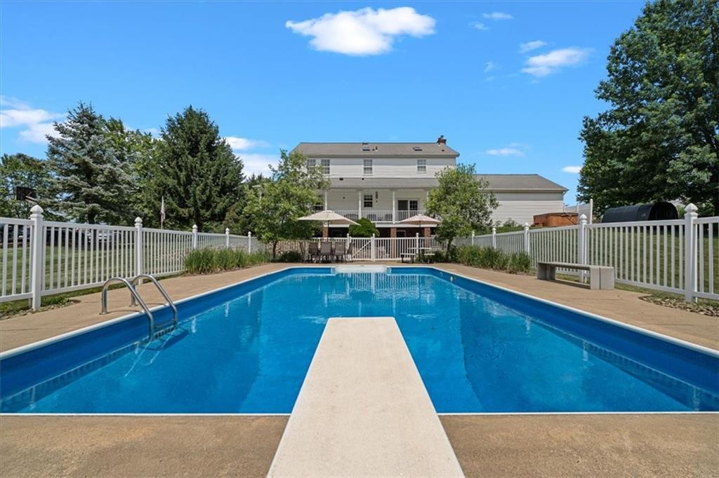 204 Salt Works Road Harmony, PA 16037 - Photo 32 of 35 a view of a swimming pool with a lounge chair