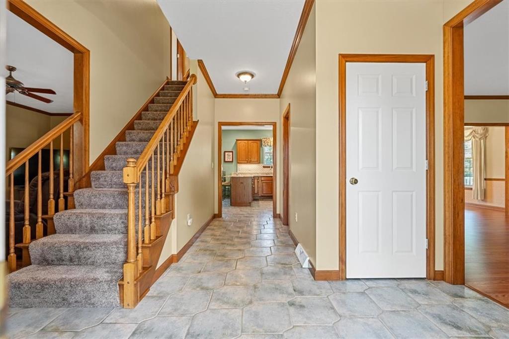 204 Salt Works Road Harmony, PA 16037 - Photo 5 of 35 a view of a hallway with wooden floor and staircase