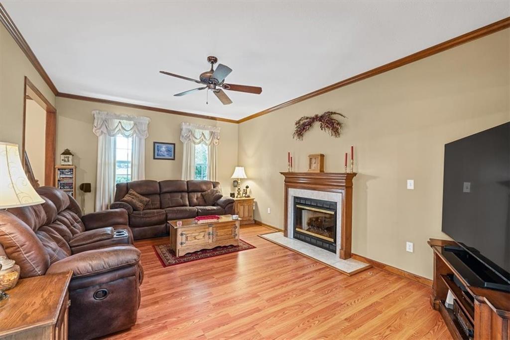 204 Salt Works Road Harmony, PA 16037 - Photo 8 of 35 a living room with furniture a fireplace and a flat screen tv