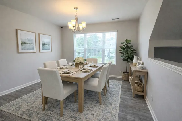 a kitchen with stainless steel appliances kitchen island granite countertop a stove and a refrigerator