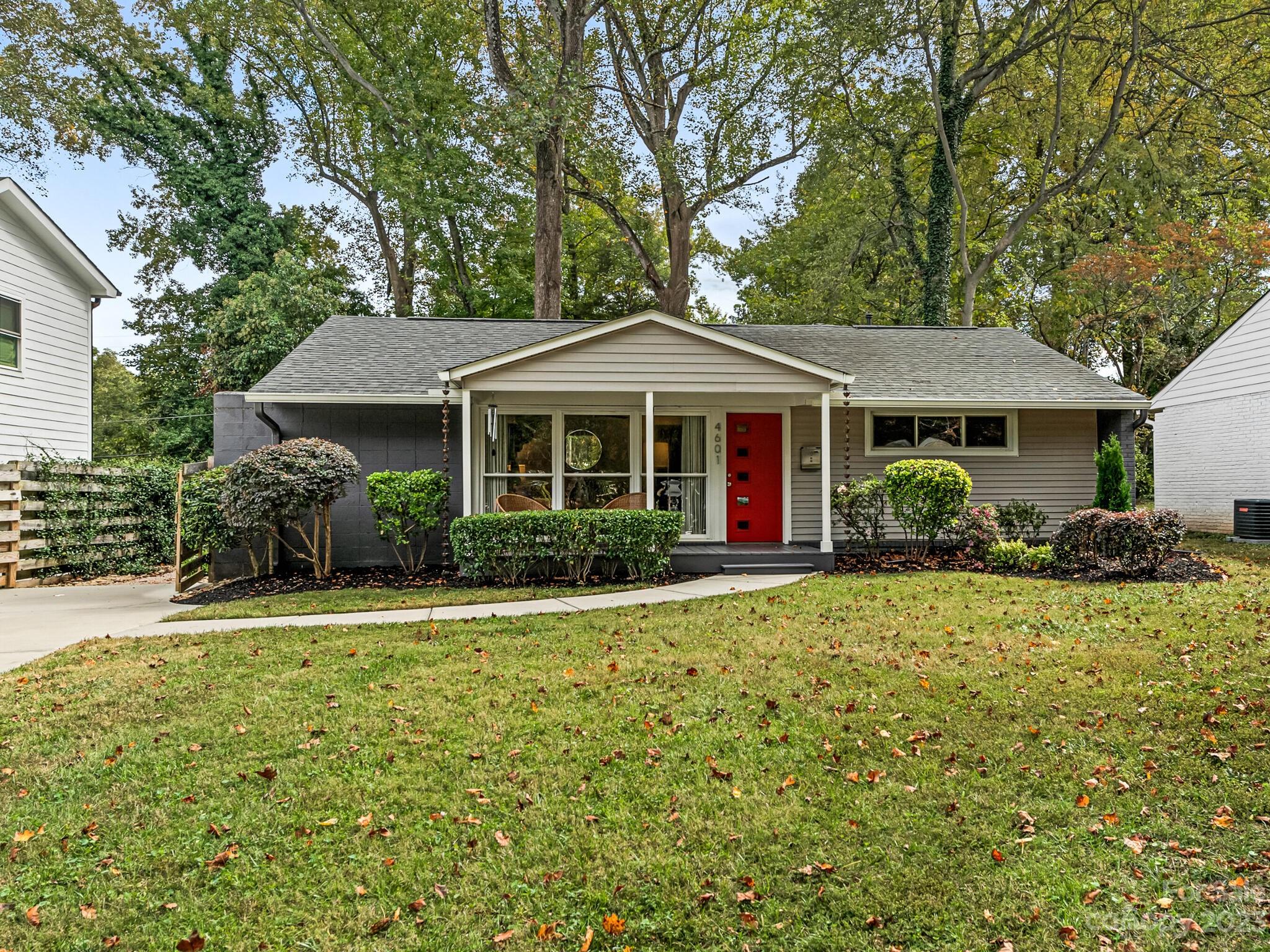 4601 Murrayhill Road Charlotte, NC 28209 - Photo 1 of 21 a front view of a house with garden