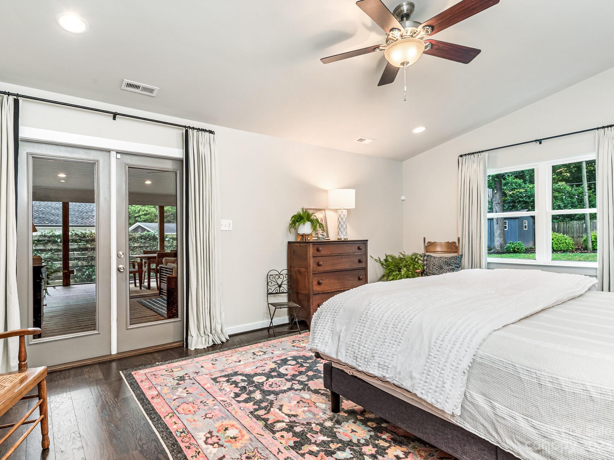 4601 Murrayhill Road Charlotte, NC 28209 - Photo 11 of 21 a bedroom with a large bed and a chandelier
