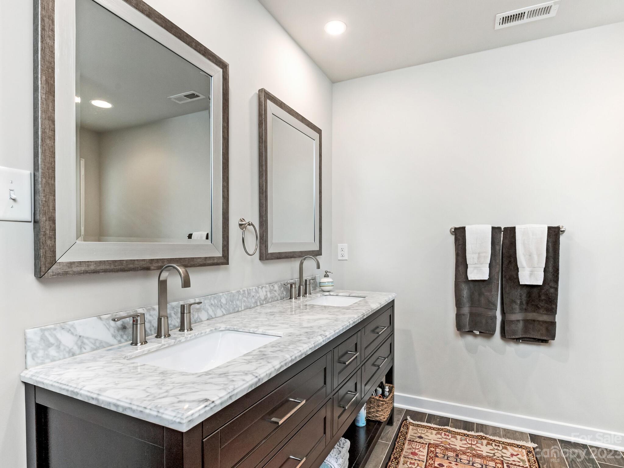 4601 Murrayhill Road Charlotte, NC 28209 - Photo 12 of 21 a bathroom with a granite countertop sink and a mirror