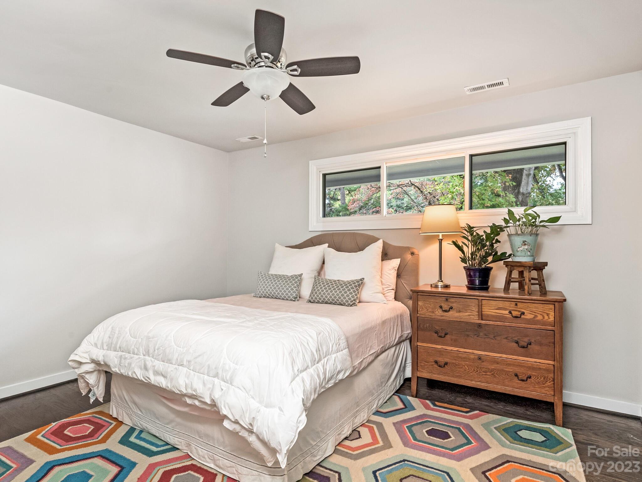 4601 Murrayhill Road Charlotte, NC 28209 - Photo 14 of 21 a bedroom with a bed and wooden floor