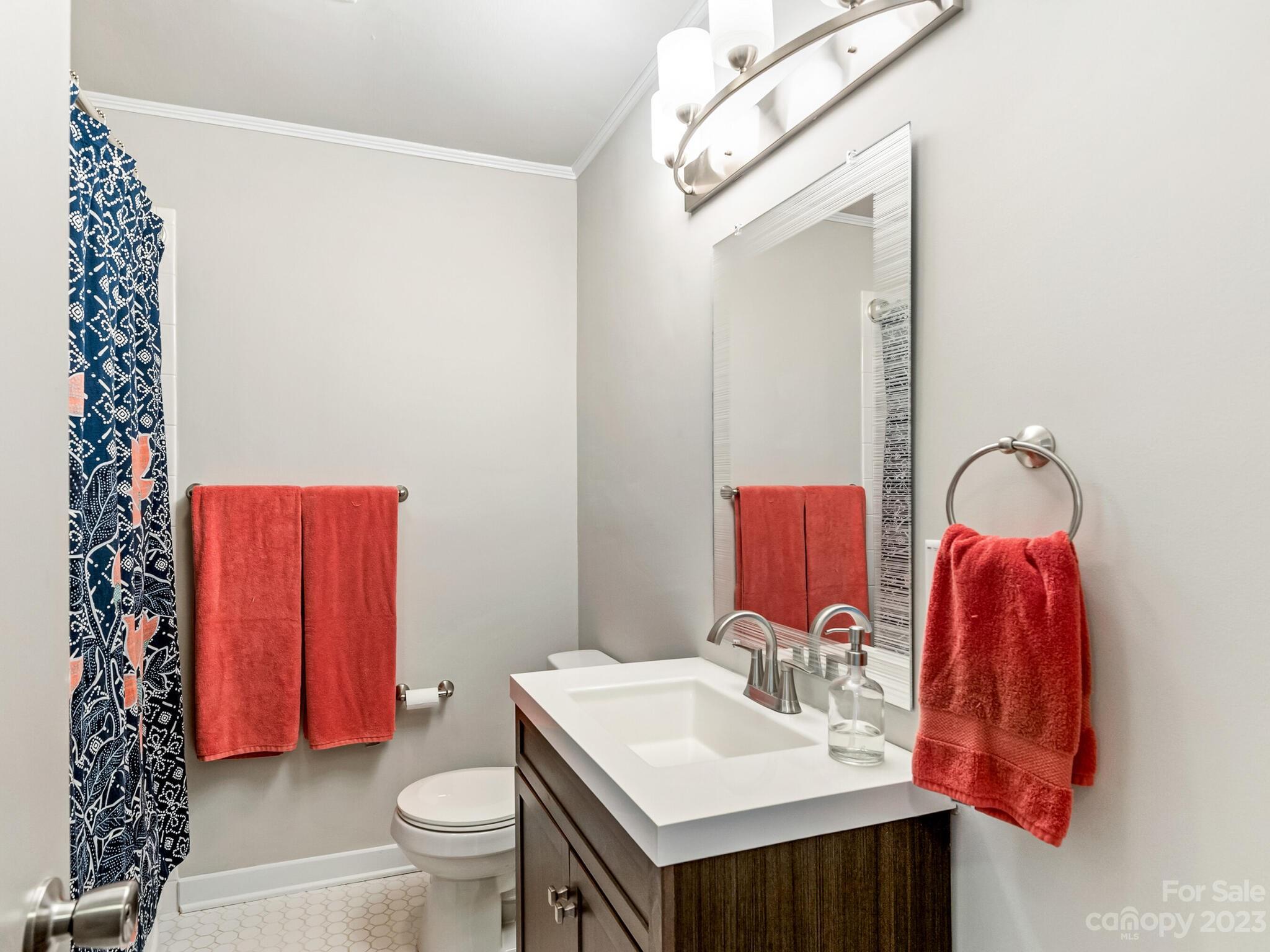 4601 Murrayhill Road Charlotte, NC 28209 - Photo 15 of 21 a bathroom with a sink vanity mirror and toilet