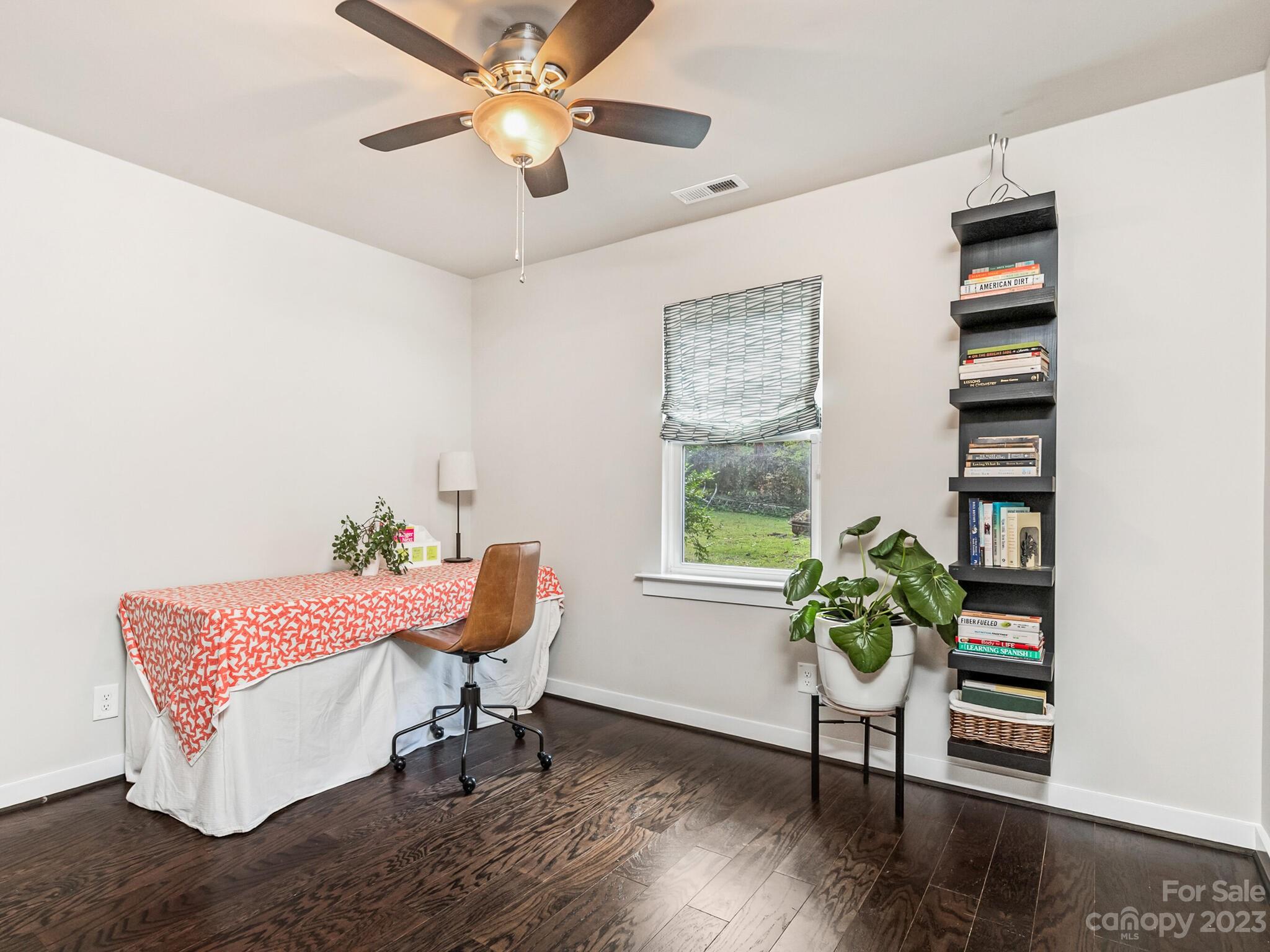 4601 Murrayhill Road Charlotte, NC 28209 - Photo 16 of 21 a living room with furniture and a potted plant