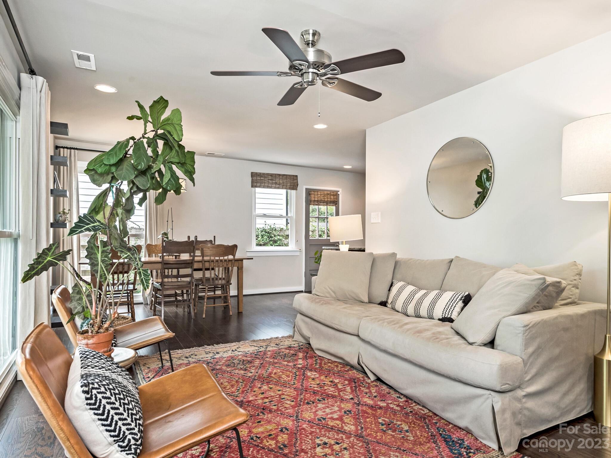 4601 Murrayhill Road Charlotte, NC 28209 - Photo 4 of 21 a living room with furniture a window and a chandelier