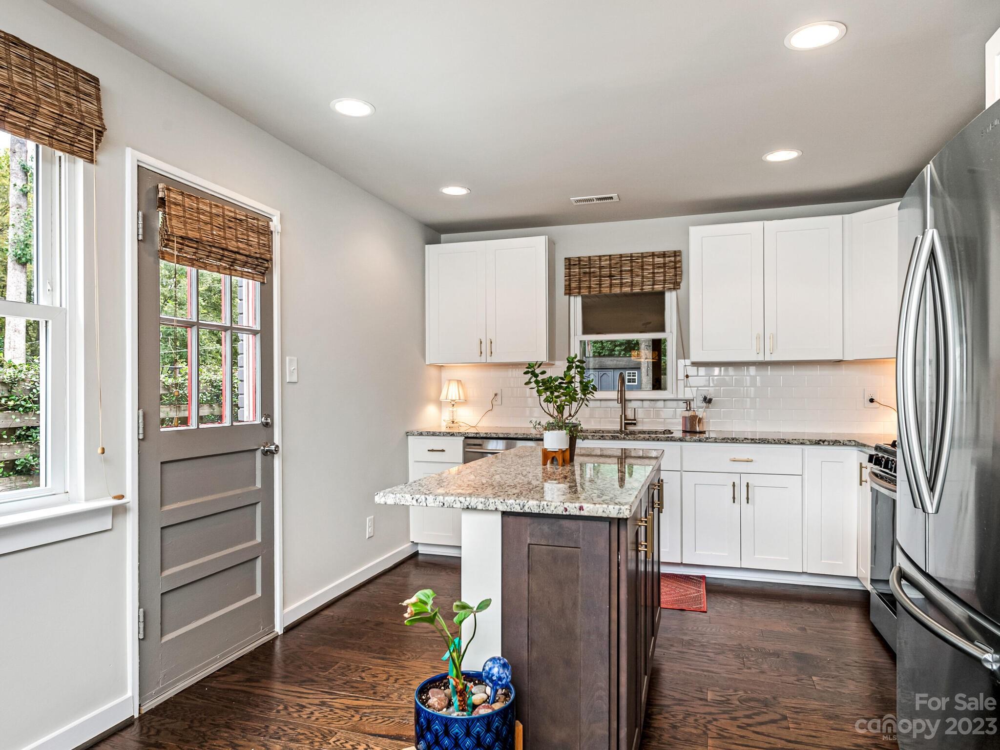 4601 Murrayhill Road Charlotte, NC 28209 - Photo 7 of 21 a kitchen with a sink stove and cabinets