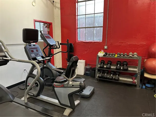 a room with furniture and gym equipment