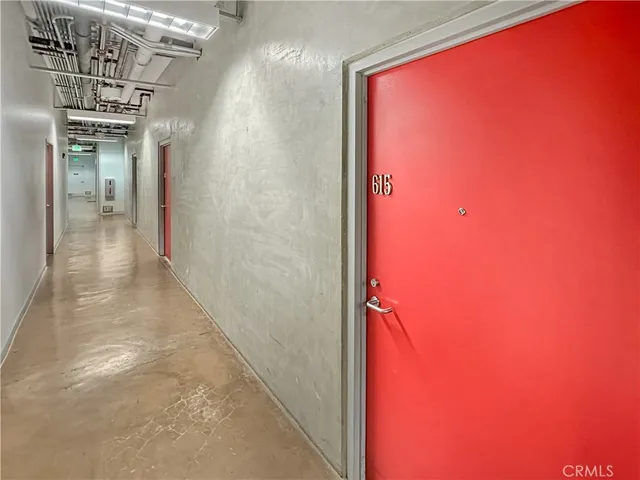 a view of a hallway with a large mirror