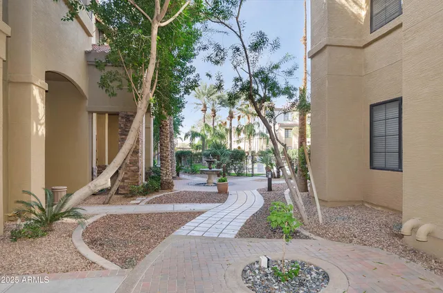 a swimming pool with outdoor seating and yard