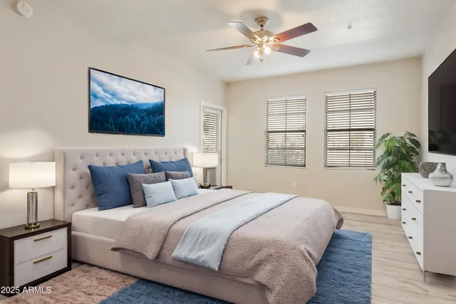 wooden floor in an empty room with a kitchen