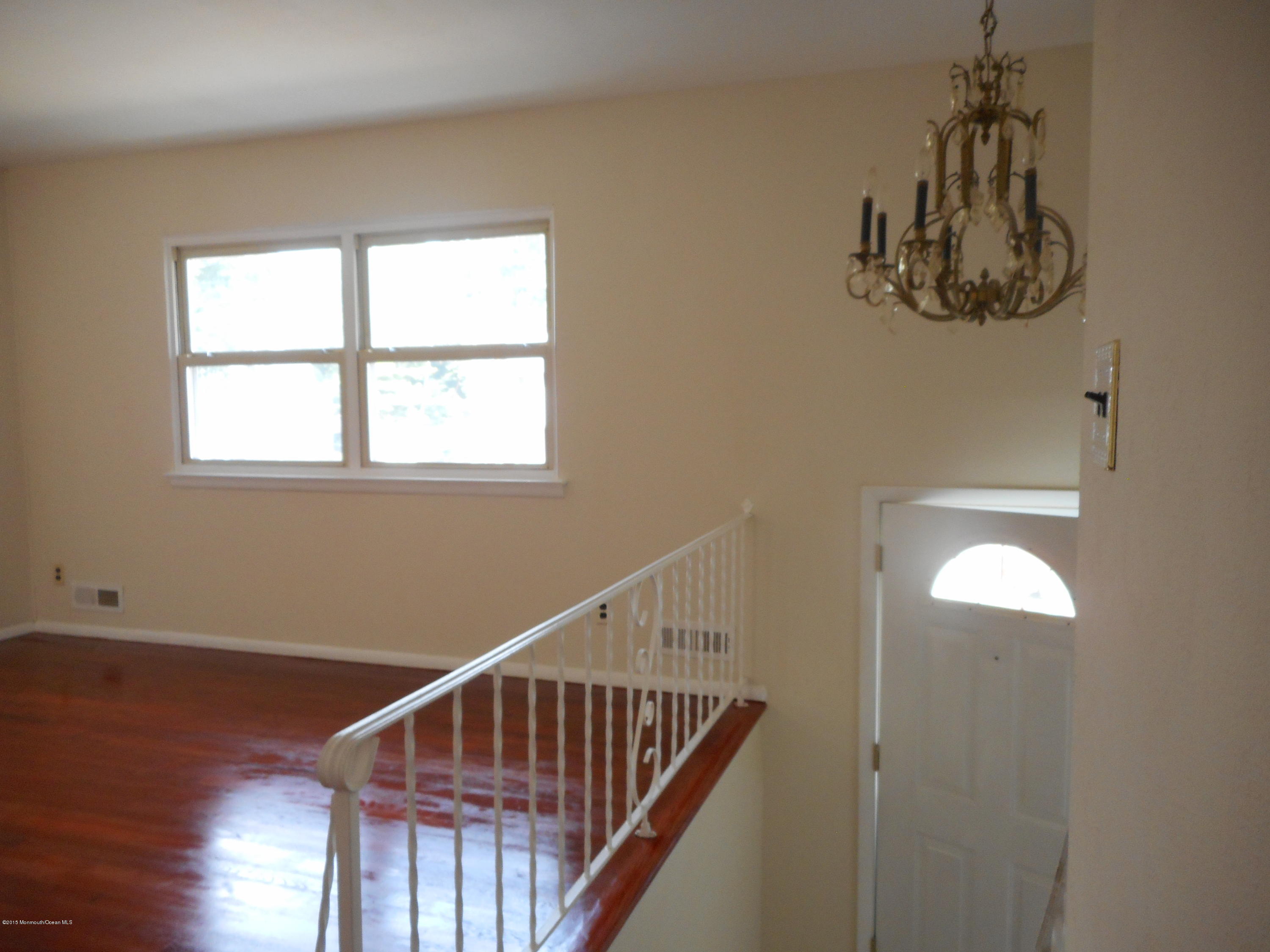 108 Darien Road Howell, NJ 07731 - Photo 12 of 22 a view of entryway with wooden floor