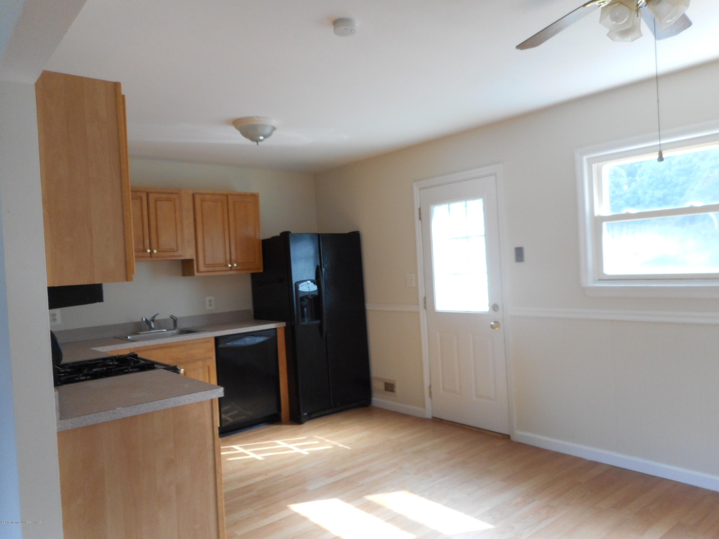 108 Darien Road Howell, NJ 07731 - Photo 13 of 22 a kitchen with stainless steel appliances granite countertop a refrigerator and a stove top oven