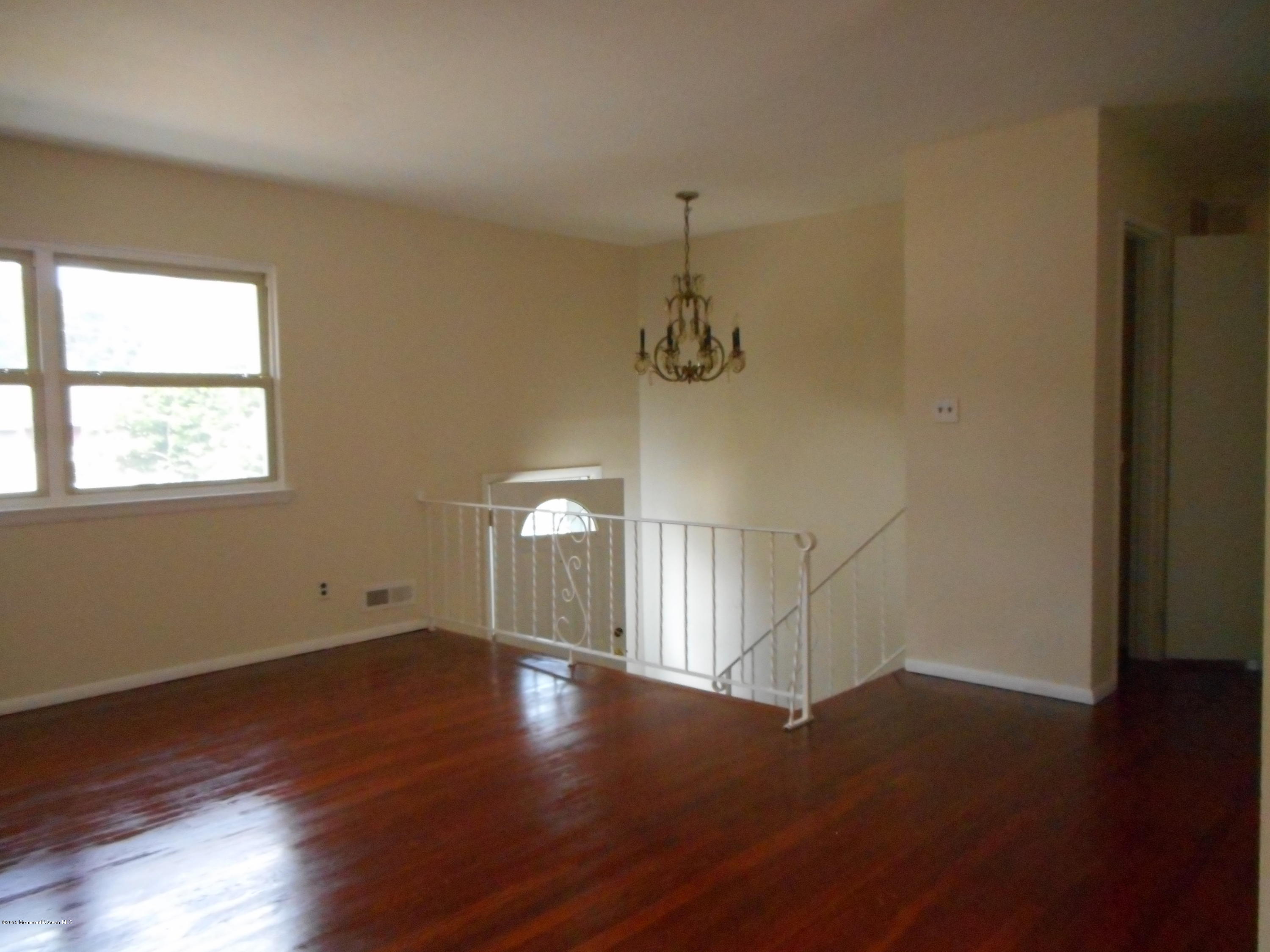 108 Darien Road Howell, NJ 07731 - Photo 17 of 22 a view of empty room with wooden floor and fan
