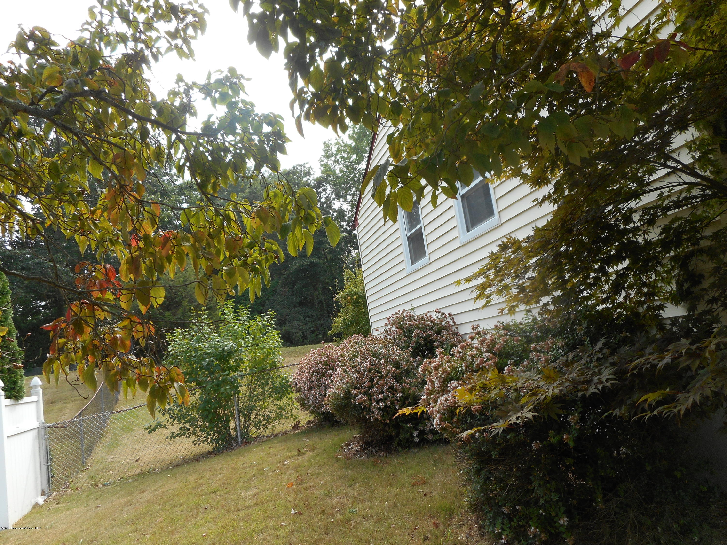 108 Darien Road Howell, NJ 07731 - Photo 18 of 22 a backyard of a house with lots of green space