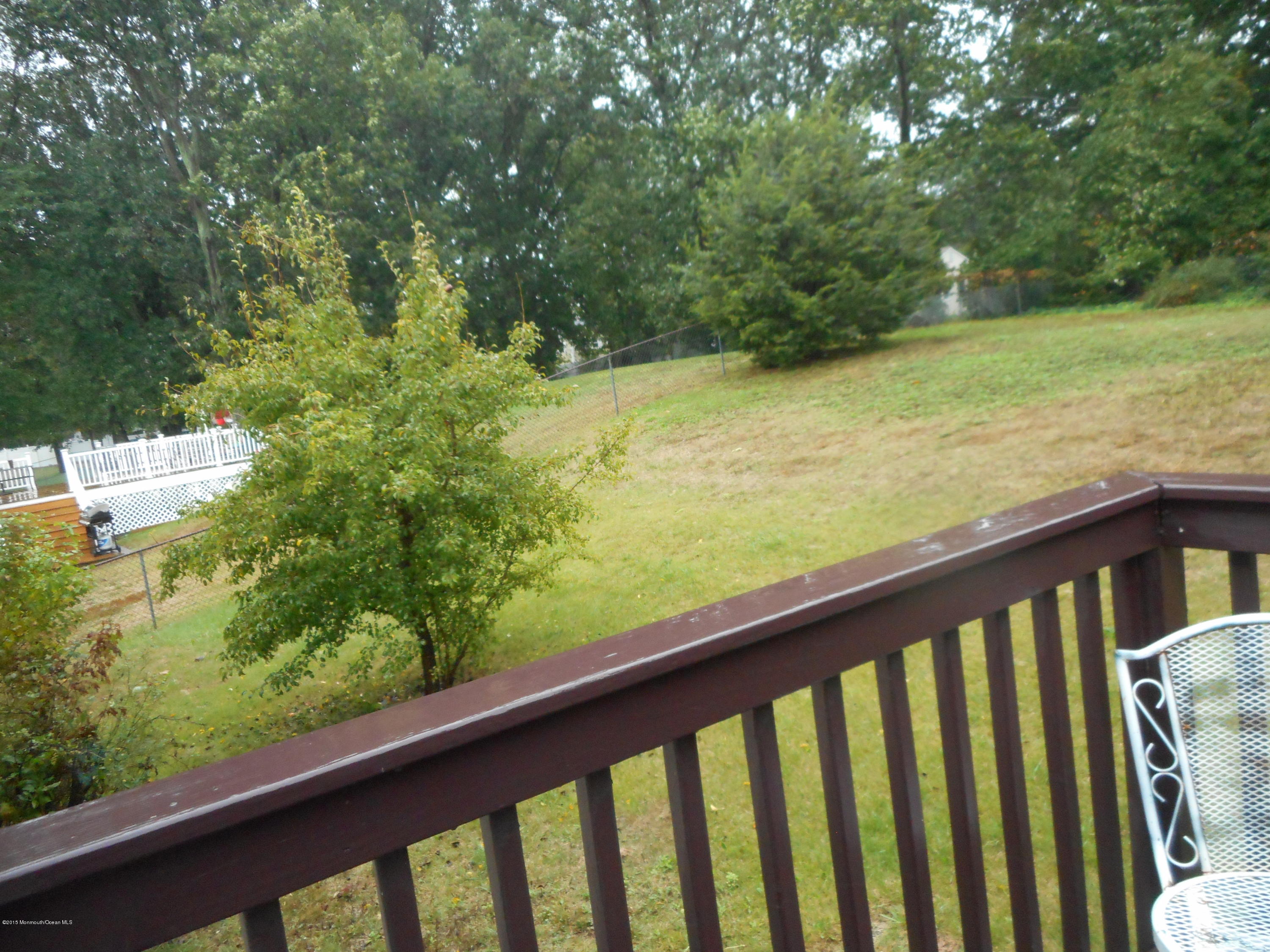108 Darien Road Howell, NJ 07731 - Photo 4 of 22 a view of balcony with yard
