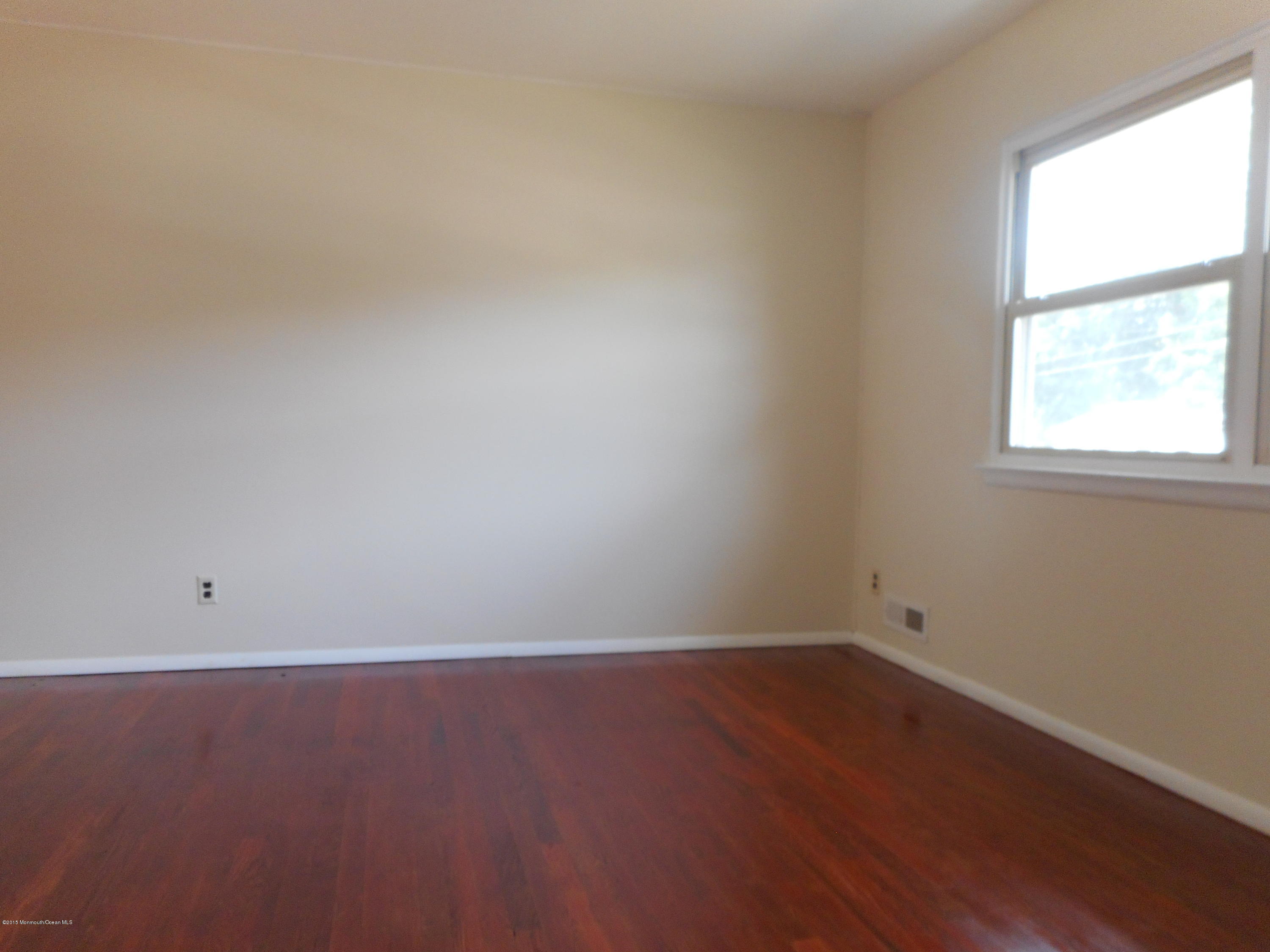 108 Darien Road Howell, NJ 07731 - Photo 6 of 22 an empty room with a window