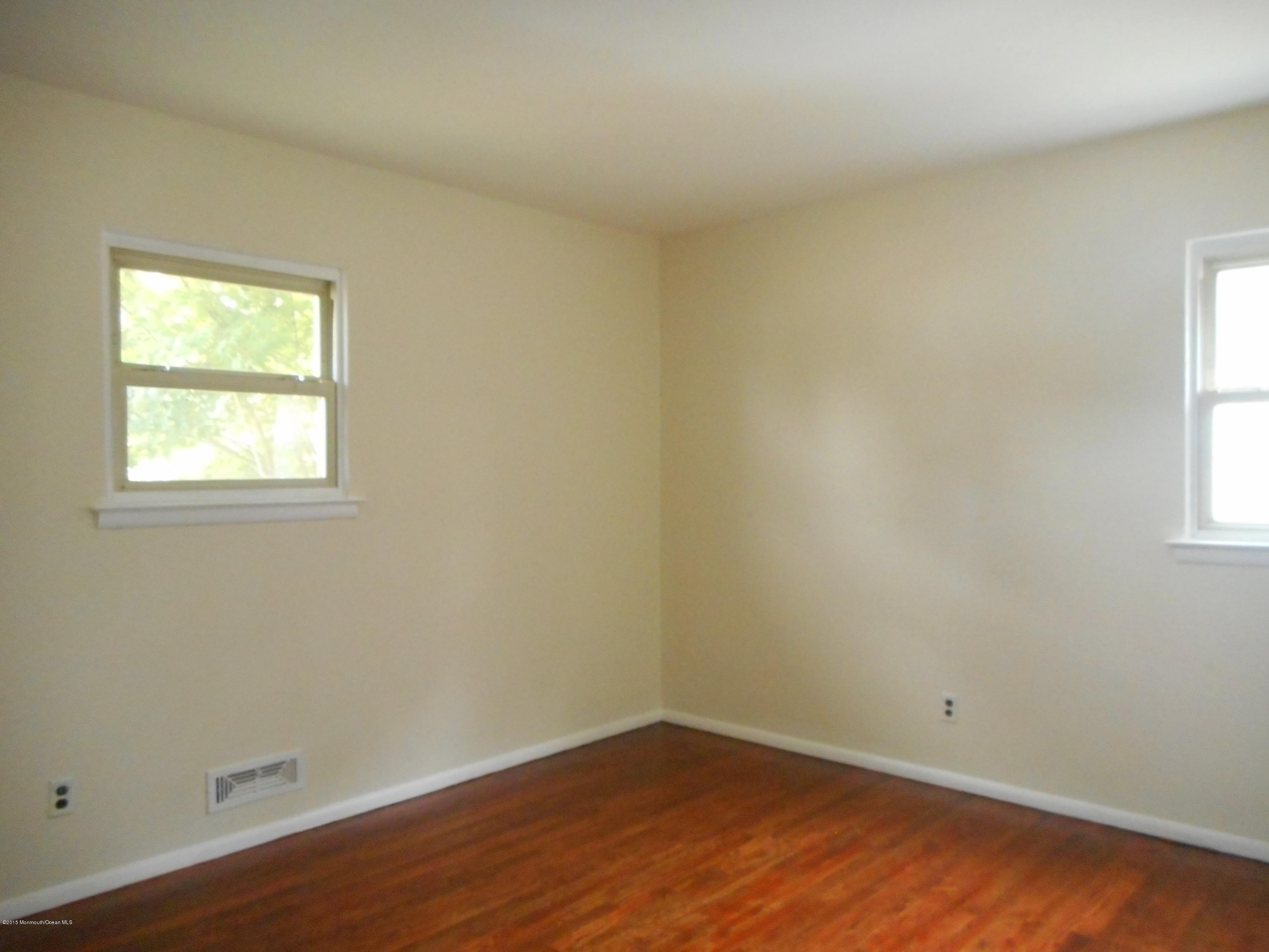 108 Darien Road Howell, NJ 07731 - Photo 7 of 22 an empty room with a window