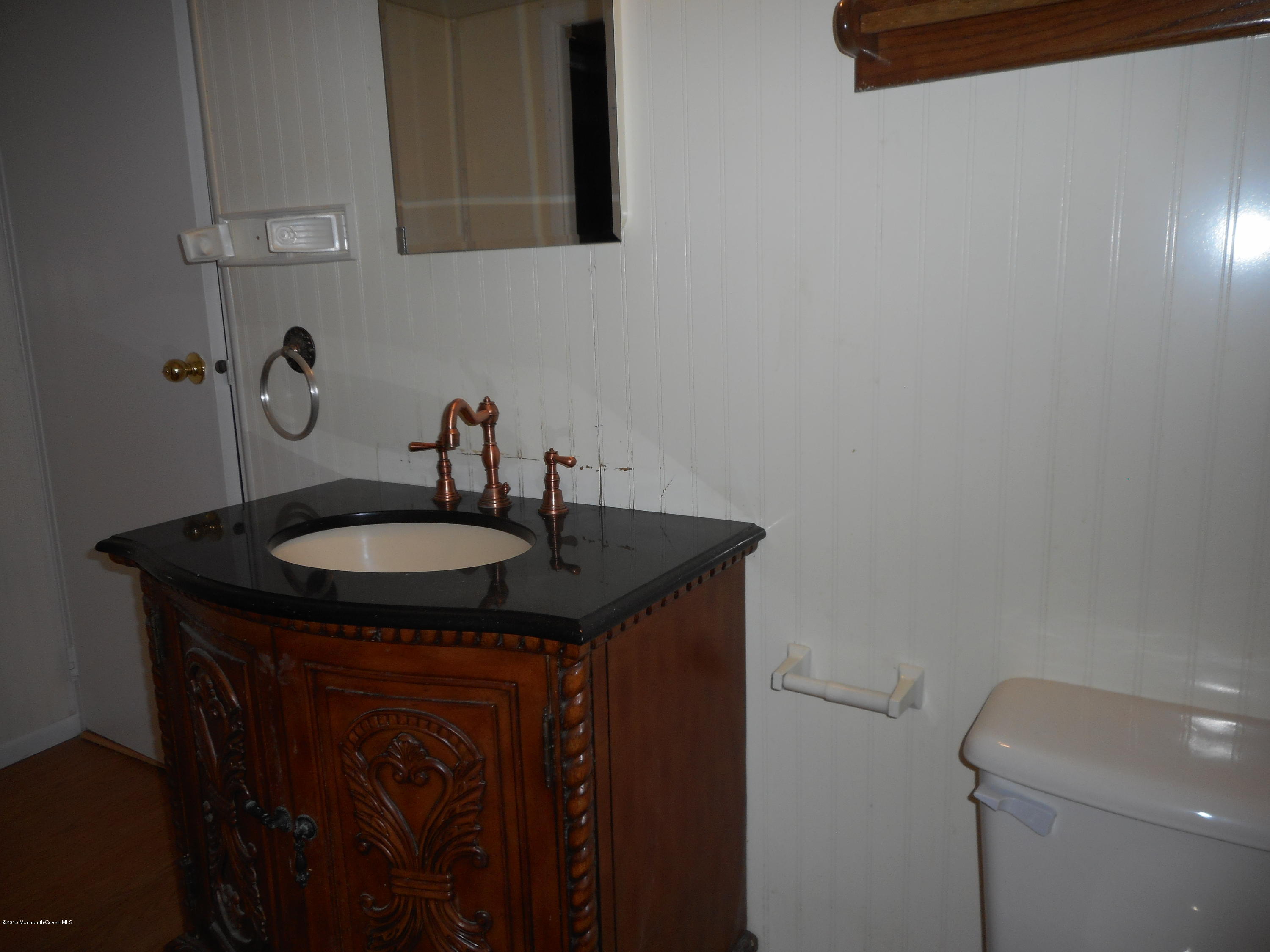 108 Darien Road Howell, NJ 07731 - Photo 8 of 22 a sink and a toilet sitting next to a sink
