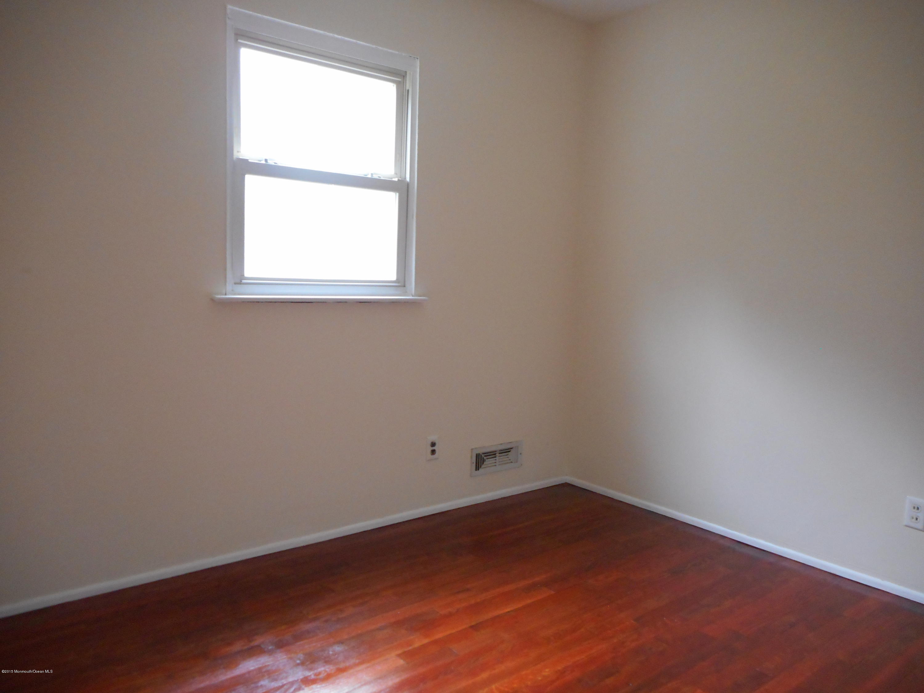 108 Darien Road Howell, NJ 07731 - Photo 9 of 22 an empty room with a window