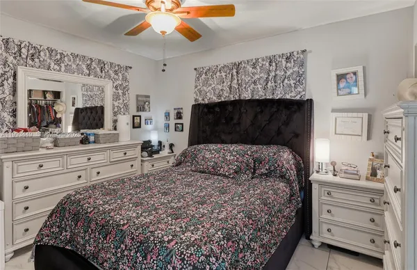 a bedroom with a bed and a dresser