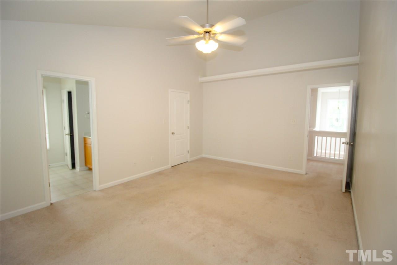 3313 Sunbright Lane Raleigh, NC 27610 - Photo 11 of 25 an empty room with windows and fan