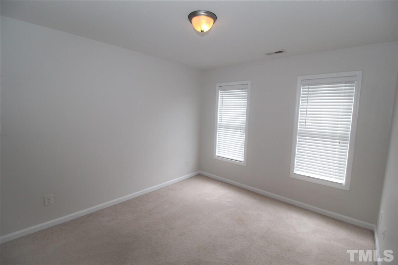 3313 Sunbright Lane Raleigh, NC 27610 - Photo 16 of 25 a view of an empty room with a window