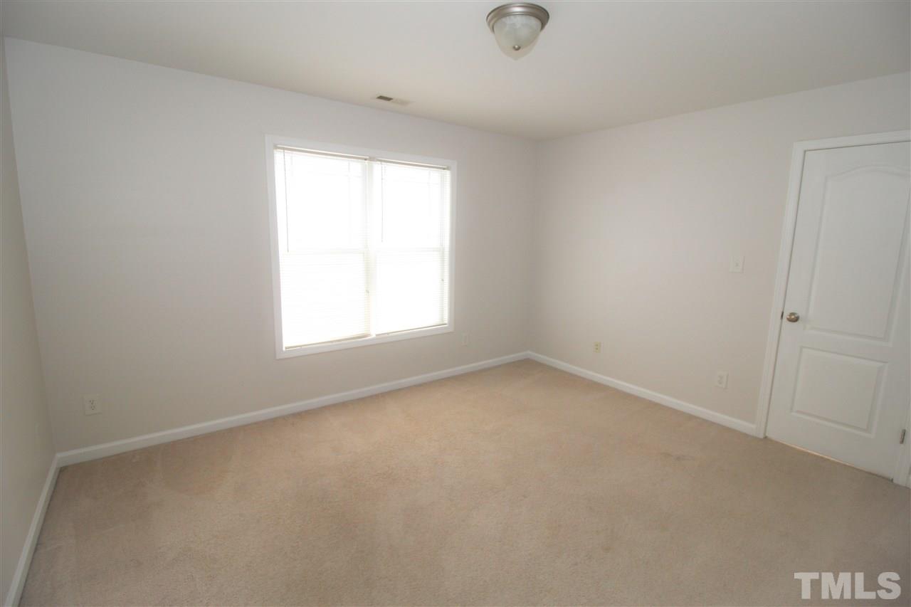 3313 Sunbright Lane Raleigh, NC 27610 - Photo 17 of 25 an empty room with a window