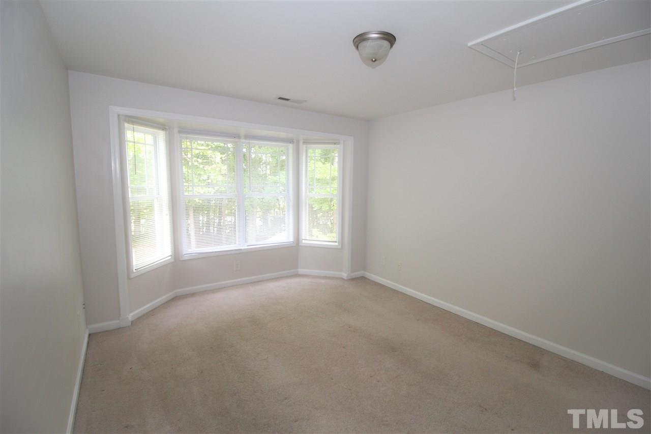 3313 Sunbright Lane Raleigh, NC 27610 - Photo 18 of 25 a view of an empty room with a window