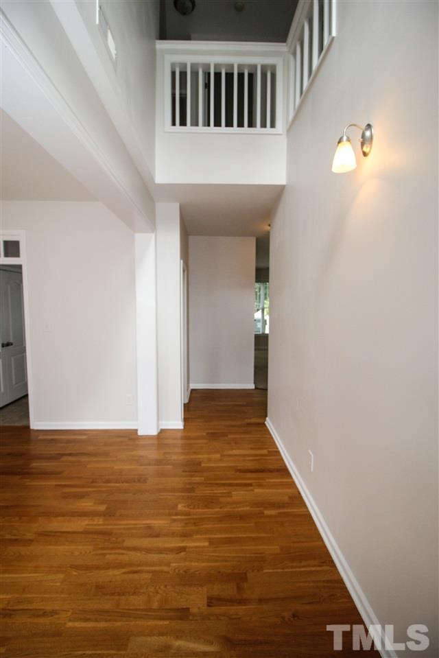 3313 Sunbright Lane Raleigh, NC 27610 - Photo 3 of 25 a view of an empty room with wooden floor