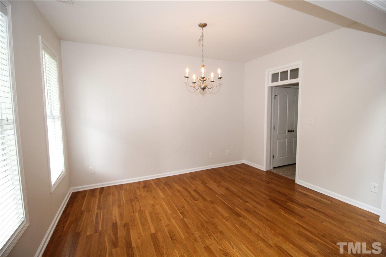 3313 Sunbright Lane Raleigh, NC 27610 - Photo 25 of 25 wooden floor in an empty room with a window