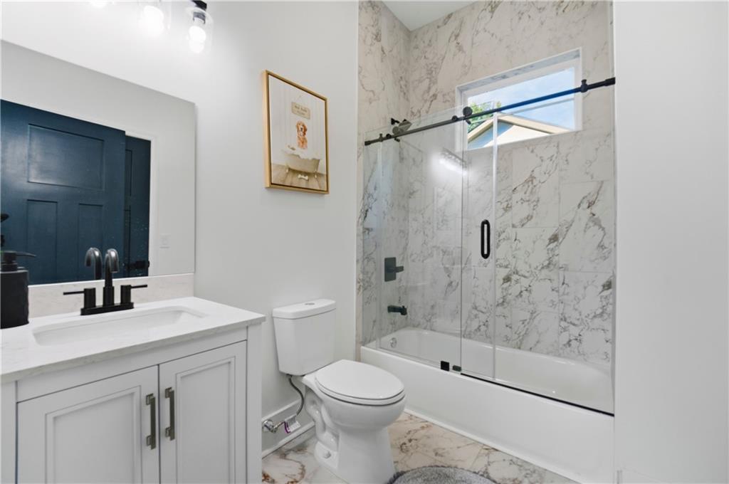 358 St Johns Avenue Southwest Atlanta, GA 30315 - Photo 17 of 35 a bathroom with a sink toilet and shower