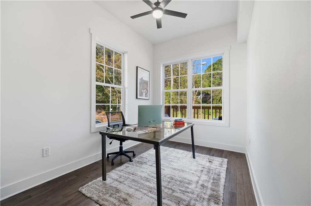 358 St Johns Avenue Southwest Atlanta, GA 30315 - Photo 18 of 35 a workspace with wooden floor and a window