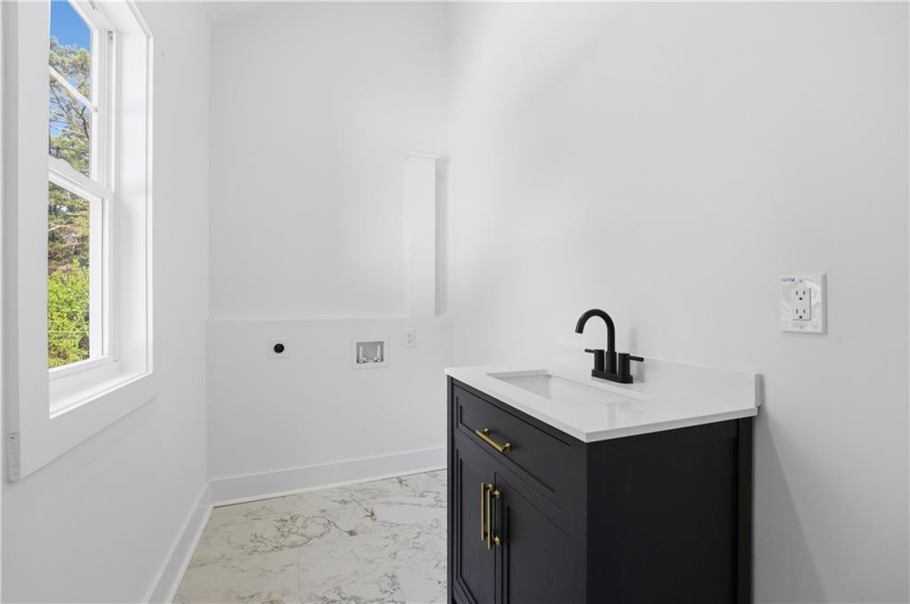 358 St Johns Avenue Southwest Atlanta, GA 30315 - Photo 20 of 35 a bathroom with a sink and a vanity