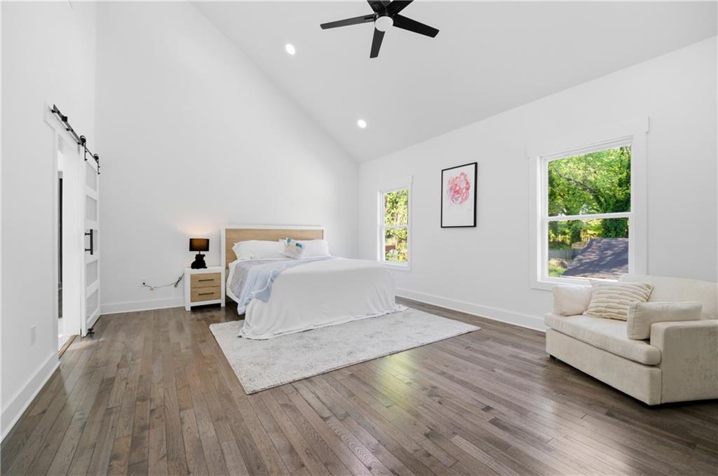 358 St Johns Avenue Southwest Atlanta, GA 30315 - Photo 25 of 35 a bedroom with a bed and wooden floor