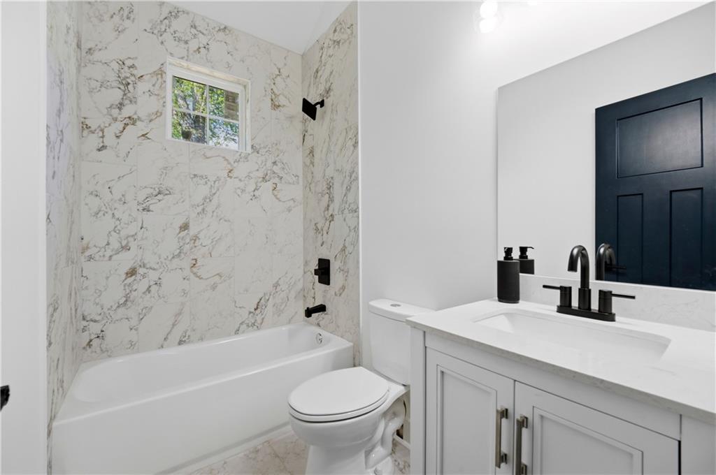 358 St Johns Avenue Southwest Atlanta, GA 30315 - Photo 30 of 35 a bathroom with a sink toilet and shower