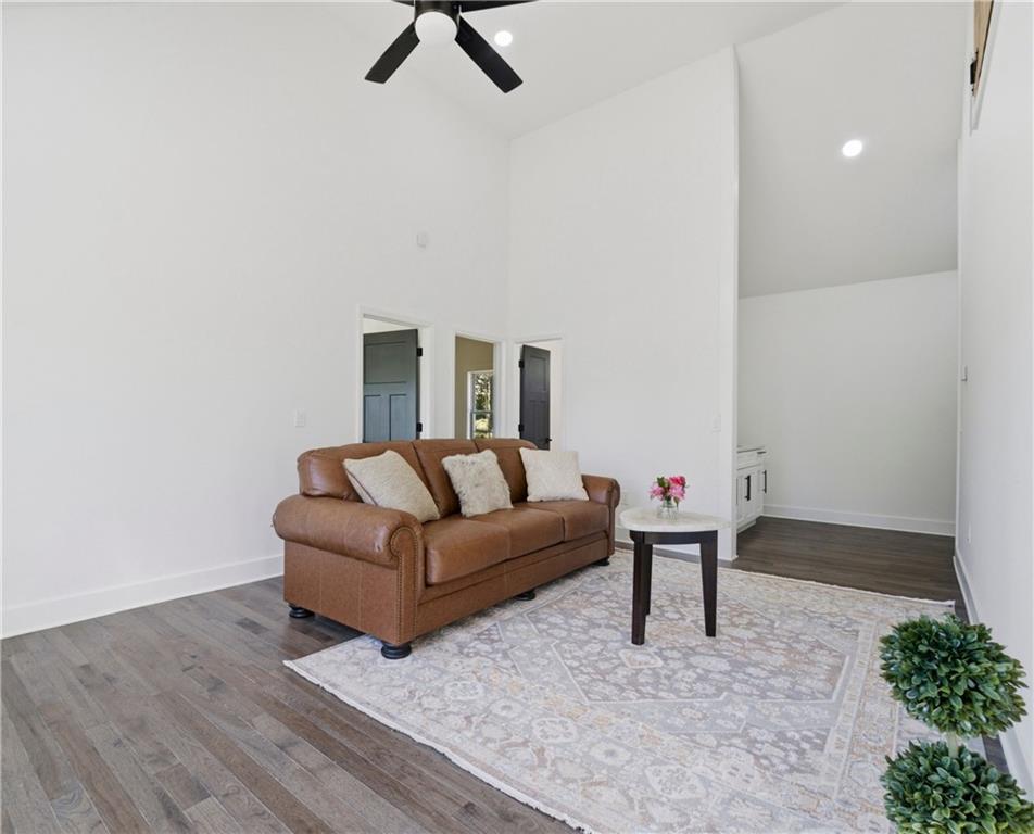 358 St Johns Avenue Southwest Atlanta, GA 30315 - Photo 31 of 35 a living room with furniture and a wooden floor