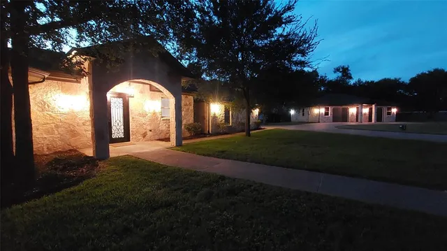 a view of yard and tree s